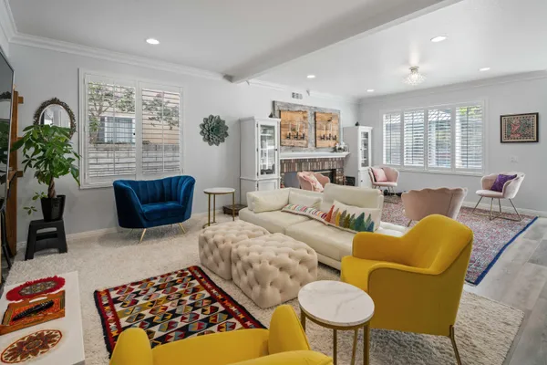 a kitchen with a sink stainless steel appliances and window