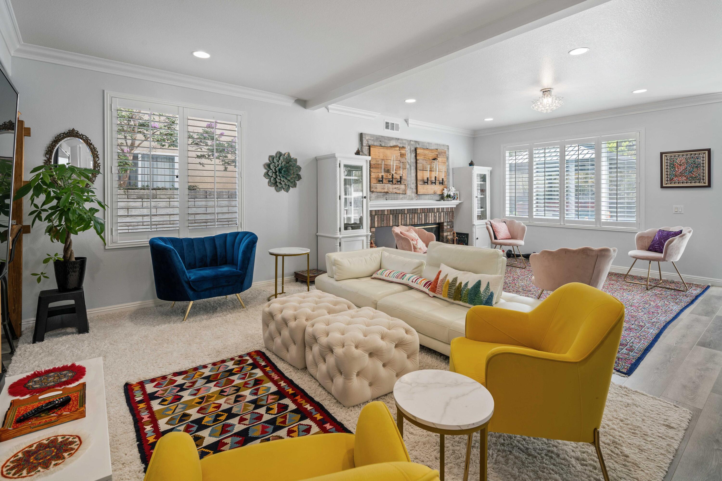 26089 Salinger Lane Stevenson Ranch, CA 91381 - Photo 15 of 47 a living room with furniture ceiling fan and a rug