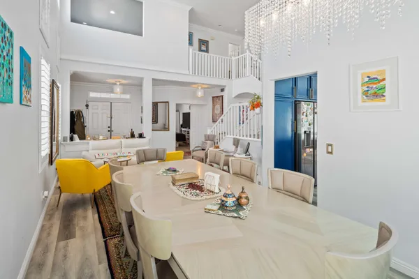 a kitchen with a refrigerator a sink a stove and cabinets