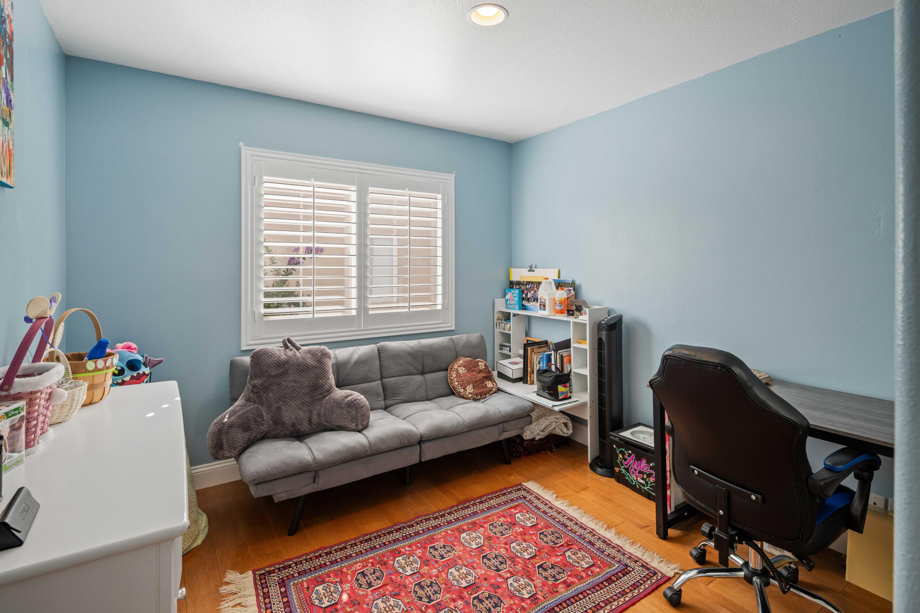 26089 Salinger Lane Stevenson Ranch, CA 91381 - Photo 35 of 47 a living room with furniture and a window