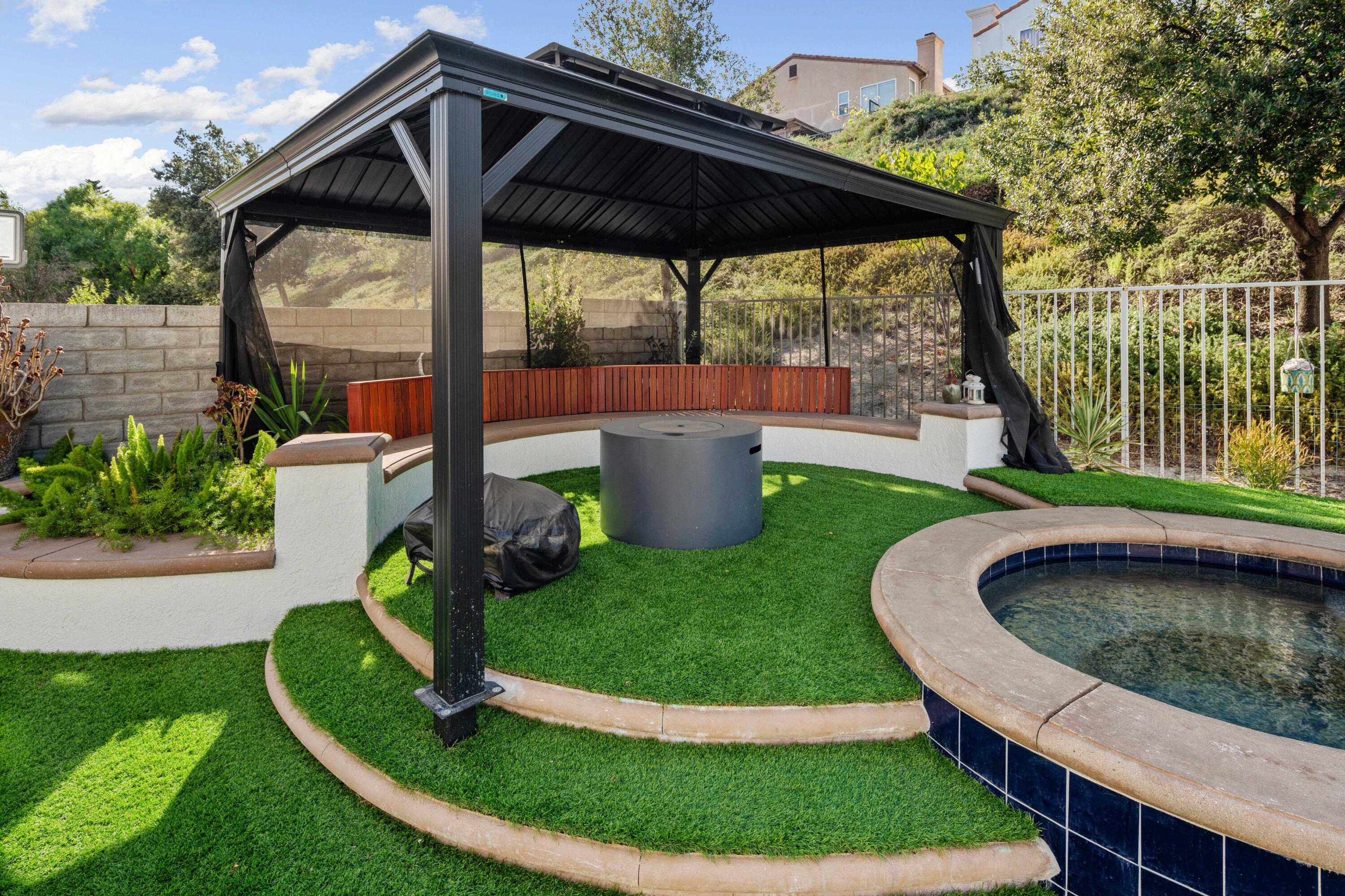 26089 Salinger Lane Stevenson Ranch, CA 91381 - Photo 46 of 47 a view of a small house with a sink and a backyard