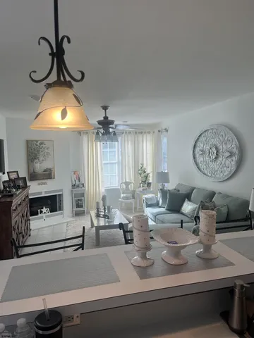 a view of living room with furniture and a fireplace
