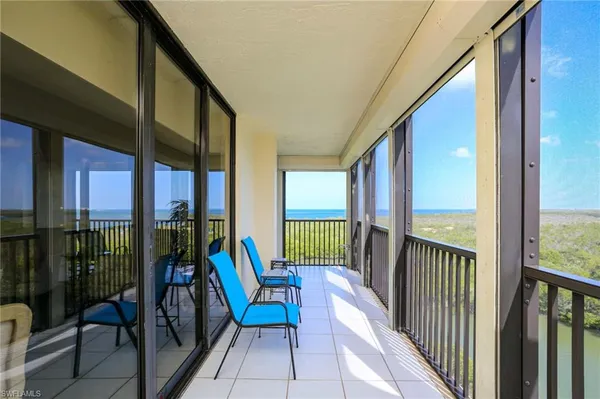 a view of a balcony with furniture