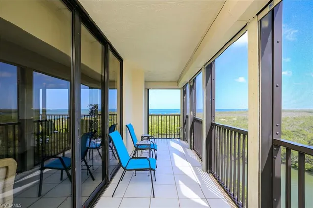a view of a balcony with furniture