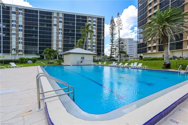 a view of a swimming pool with a patio