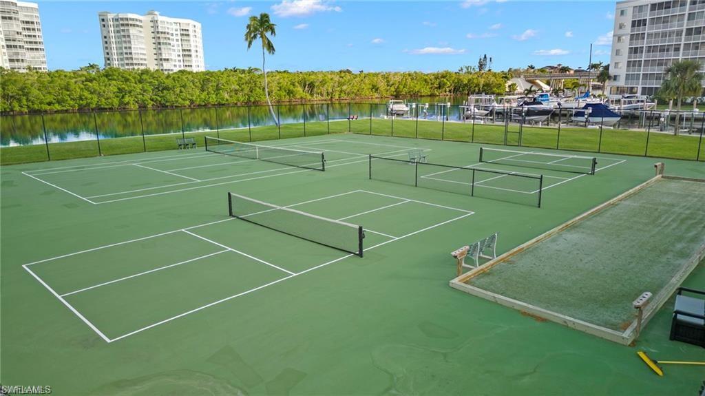 15 Bluebill Avenue, Unit 805 Naples, FL 34108 - Photo 18 of 29 a view of a tennis court
