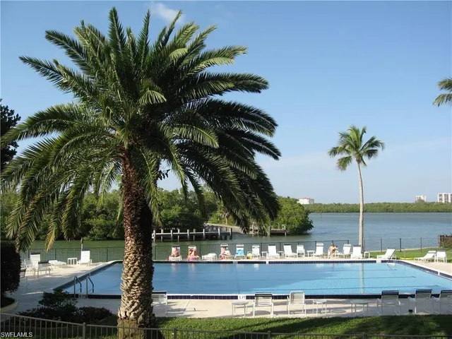 a view of a palm trees in front of a house