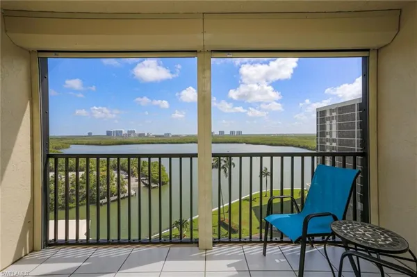 a view of a balcony with furniture