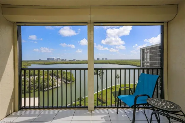 a view of a balcony with furniture