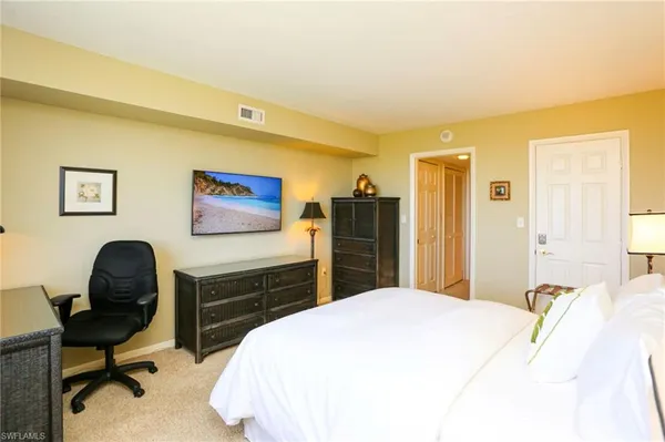 a bedroom with a bed and furniture