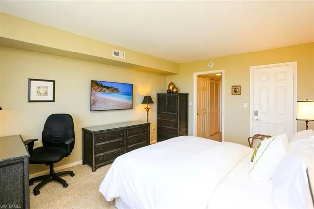 a bedroom with a bed and furniture