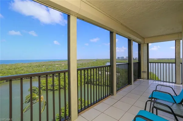 a view of a balcony with furniture