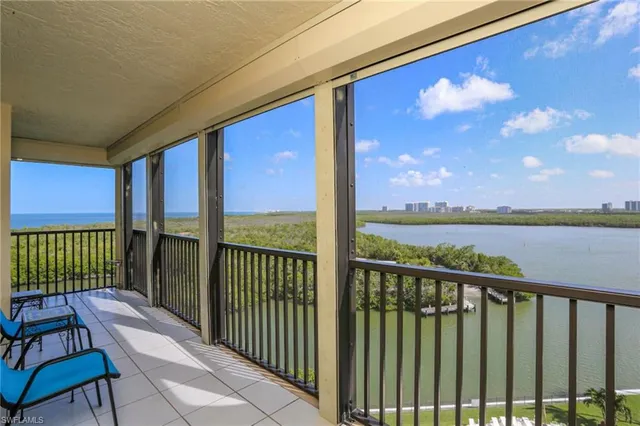 a view of a balcony with furniture