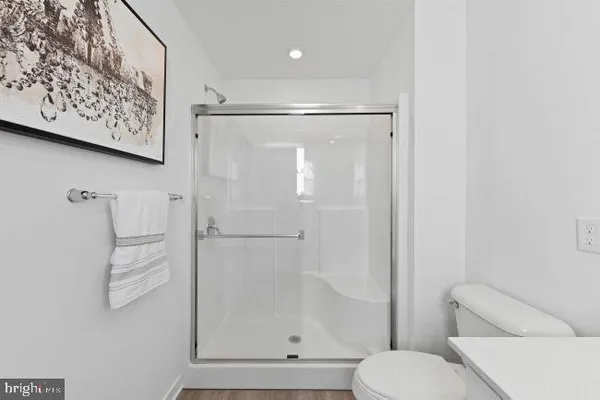 a bathroom with a shower and a toilet