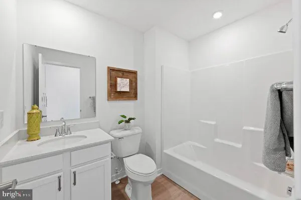 a bathroom with a sink toilet and bathtub