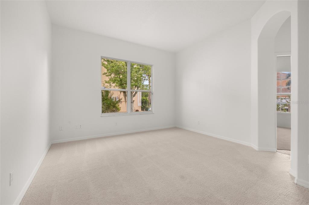 2172 The Oaks Boulevard Kissimmee, FL 34746 - Photo 11 of 81 an empty room with windows