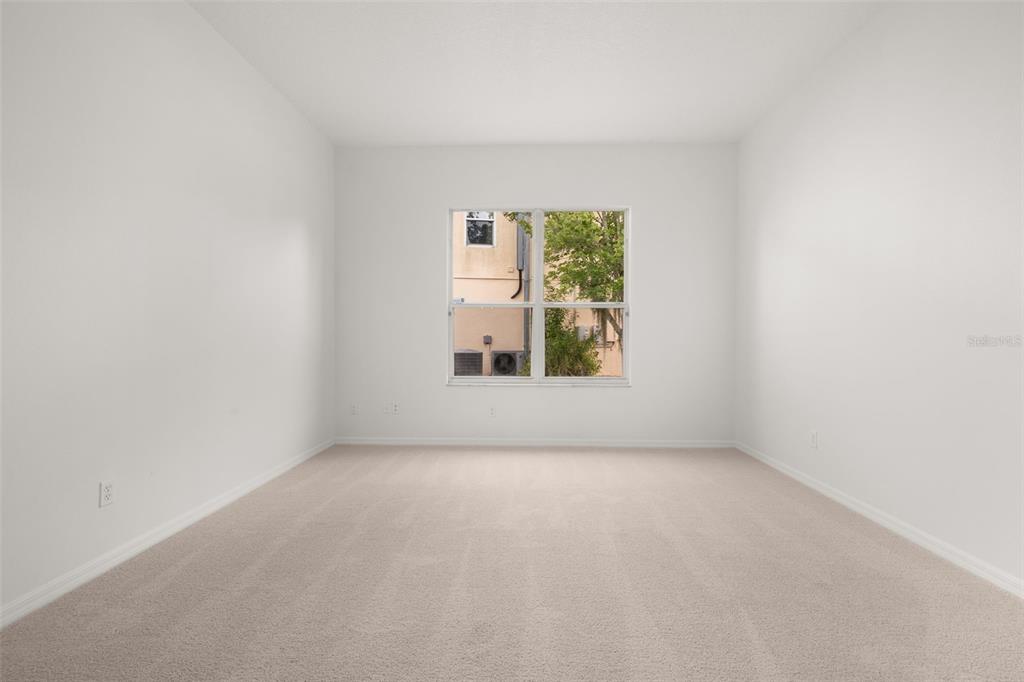 2172 The Oaks Boulevard Kissimmee, FL 34746 - Photo 12 of 81 a view of an empty room with a window