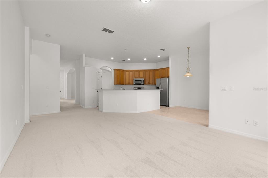 2172 The Oaks Boulevard Kissimmee, FL 34746 - Photo 18 of 81 a view of a kitchen with a sink and white cabinets