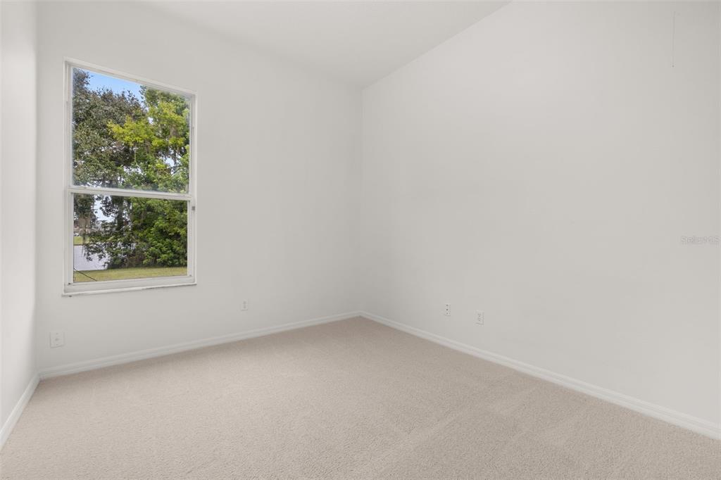 2172 The Oaks Boulevard Kissimmee, FL 34746 - Photo 30 of 81 an empty room with a window