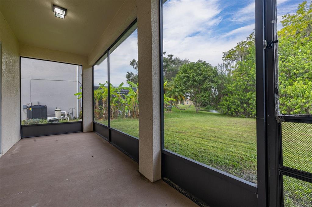 2172 The Oaks Boulevard Kissimmee, FL 34746 - Photo 48 of 81 a view of a garden from a window