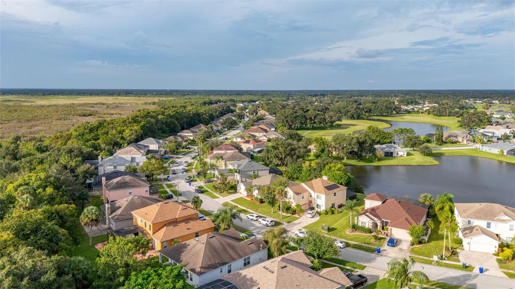 2172 The Oaks Boulevard Kissimmee, FL 34746 - Photo 54 of 81 an aerial view of ocean and residential houses with outdoor space