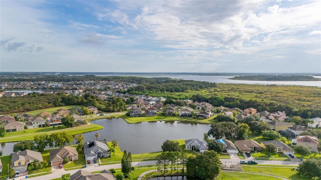 2172 The Oaks Boulevard Kissimmee, FL 34746 - Photo 66 of 81 an aerial view of ocean and residential houses with outdoor space
