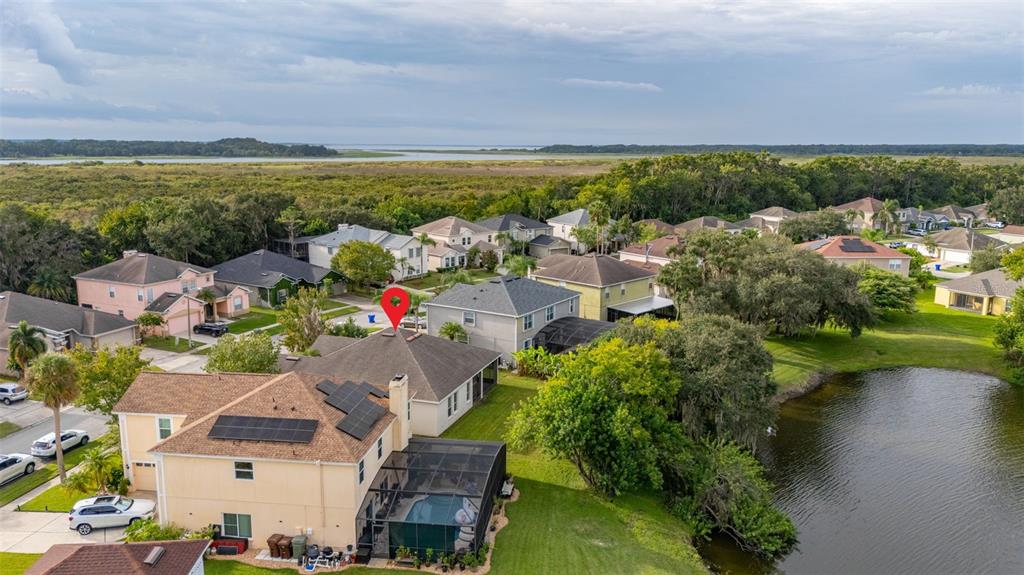 2172 The Oaks Boulevard Kissimmee, FL 34746 - Photo 73 of 81 an aerial view of a house with a lake view