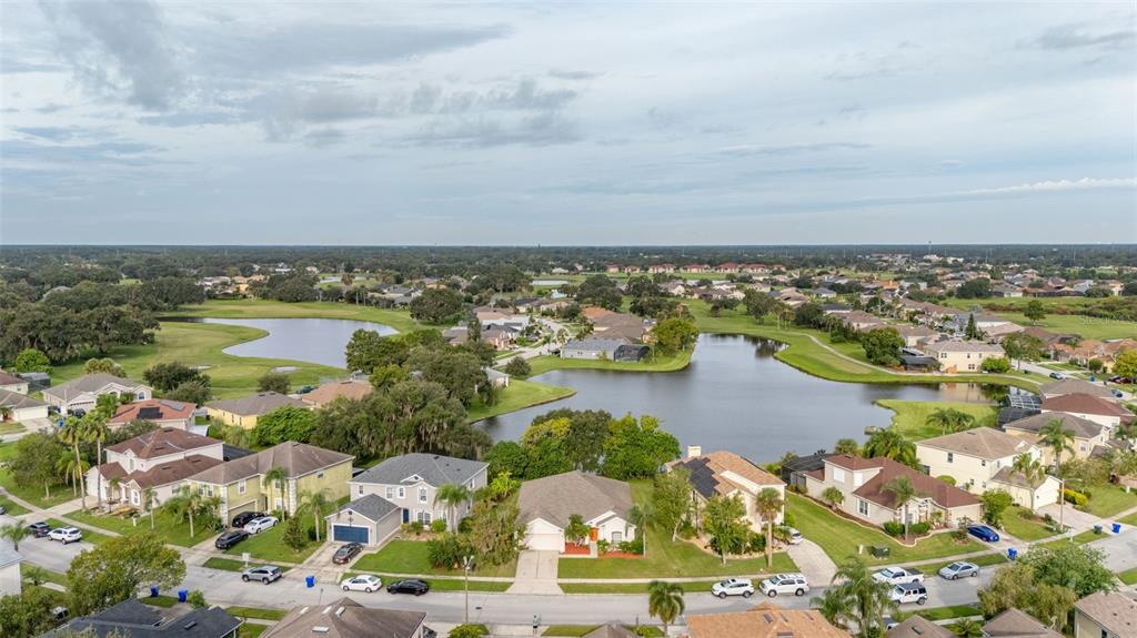 2172 The Oaks Boulevard Kissimmee, FL 34746 - Photo 78 of 81 an aerial view of residential building and lake