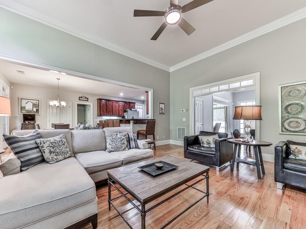1076 Pinyan Lane Canton, GA 30115 - Photo 18 of 71 a living room with furniture and a wooden floor