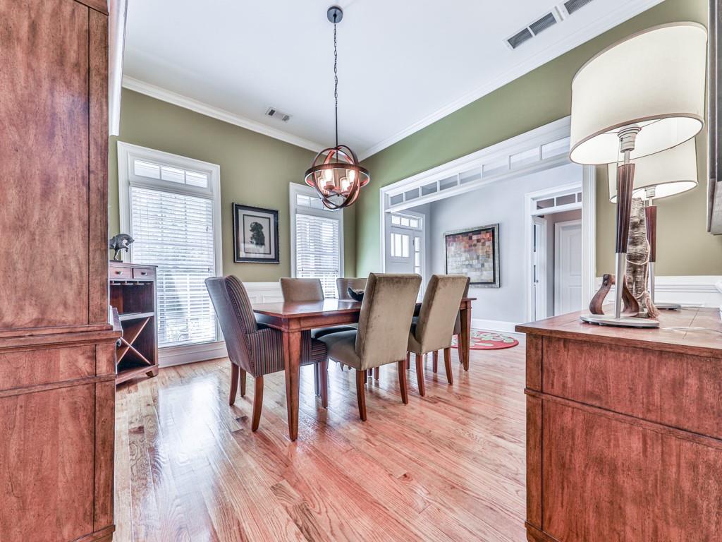 1076 Pinyan Lane Canton, GA 30115 - Photo 27 of 71 a view of a dining room with furniture window and wooden floor