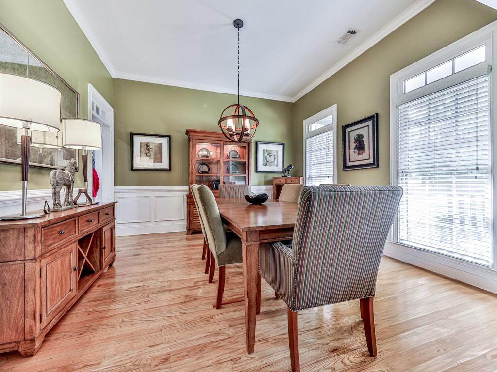 1076 Pinyan Lane Canton, GA 30115 - Photo 28 of 71 a view of a dining room with furniture window and wooden floor