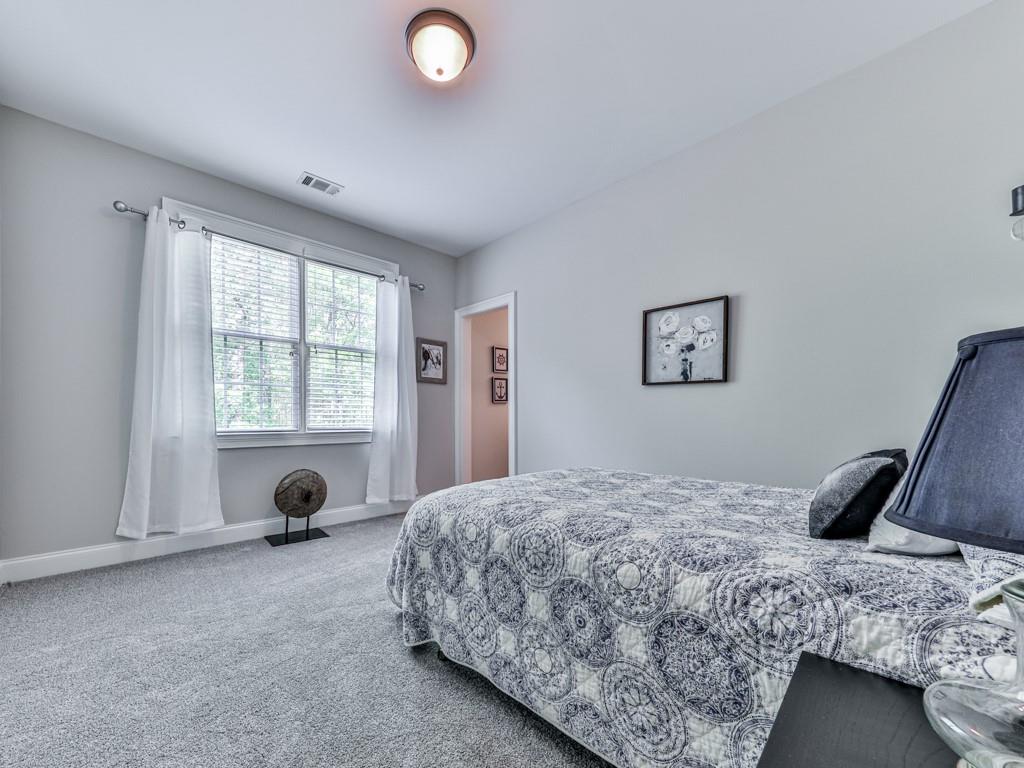 1076 Pinyan Lane Canton, GA 30115 - Photo 37 of 71 a bedroom with a bed and a window