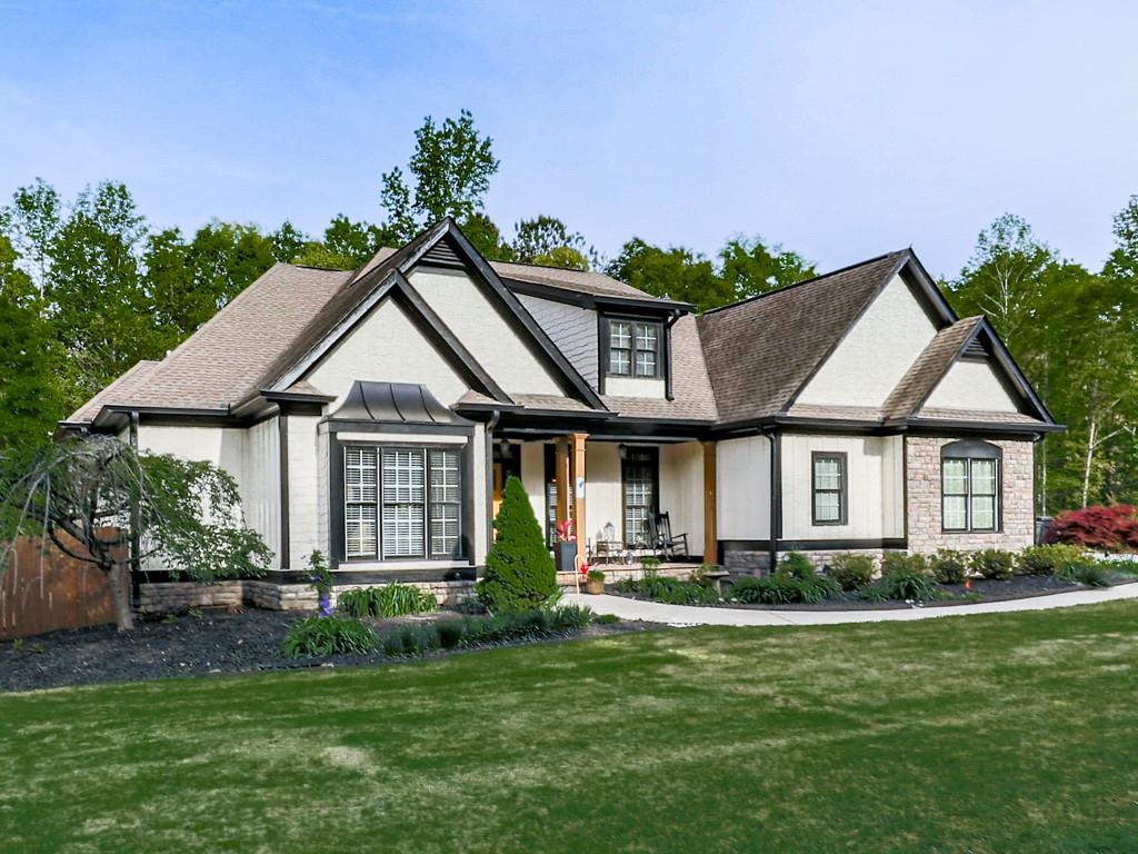 1076 Pinyan Lane Canton, GA 30115 - Photo 4 of 71 a front view of a house with a yard