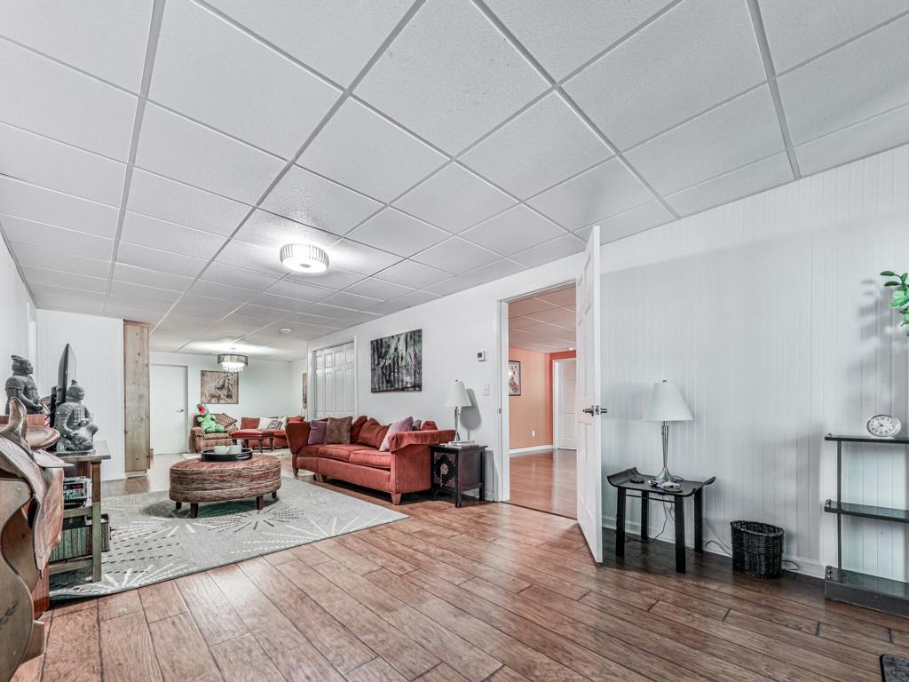 1076 Pinyan Lane Canton, GA 30115 - Photo 45 of 71 a bedroom with furniture and wooden floor