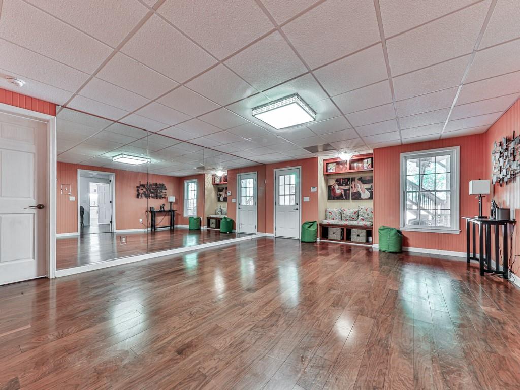 1076 Pinyan Lane Canton, GA 30115 - Photo 46 of 71 an empty room with wooden floor and natural light