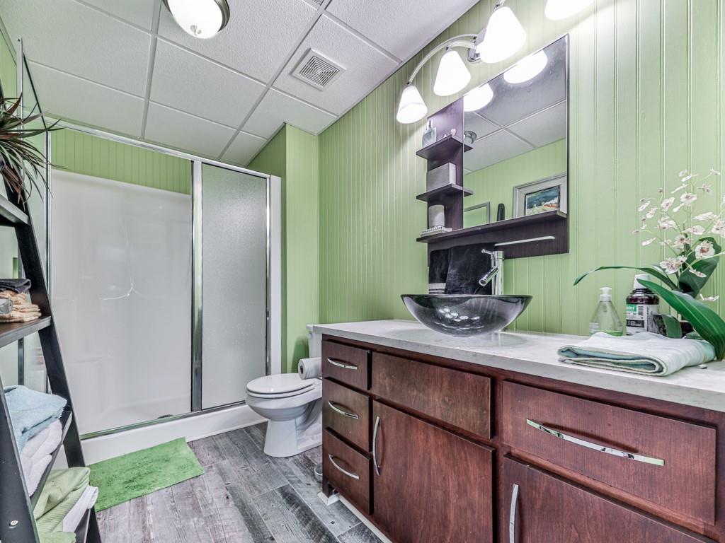 1076 Pinyan Lane Canton, GA 30115 - Photo 48 of 71 a bathroom with a sink a toilet and mirror