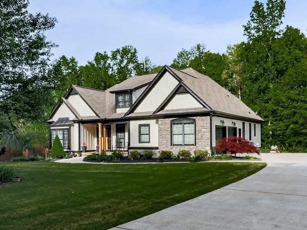 1076 Pinyan Lane Canton, GA 30115 - Photo 57 of 71 a front view of house with yard and green space