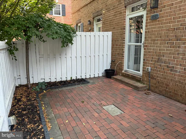 a garden with flowers and trees