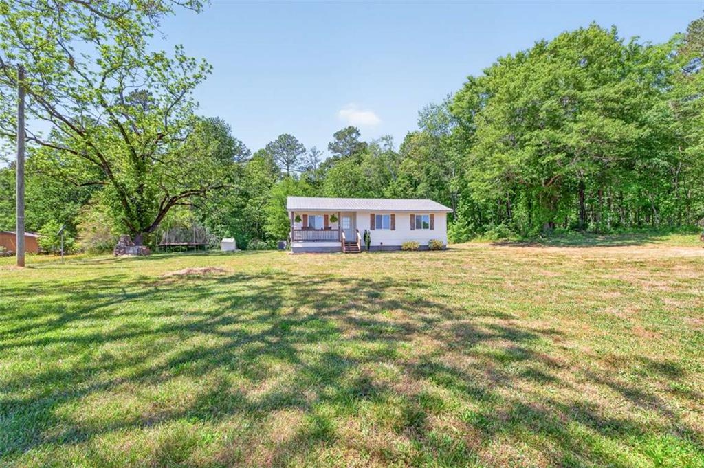 3696 Crabapple Hollow Road Nicholson, GA 30565 - Photo 30 of 38 a house view with a garden space
