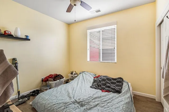 a bathroom with a sink a toilet a mirror and shower curtain