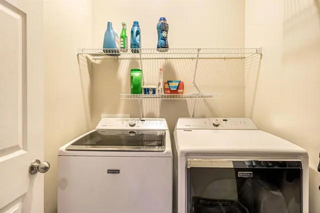 a view of a livingroom with a ceiling fan and window