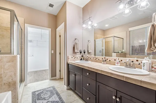 a bathroom with a bathtub and a shower