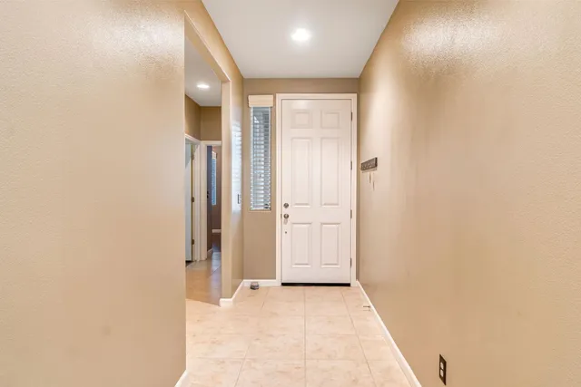 a view of a hallway with a living room