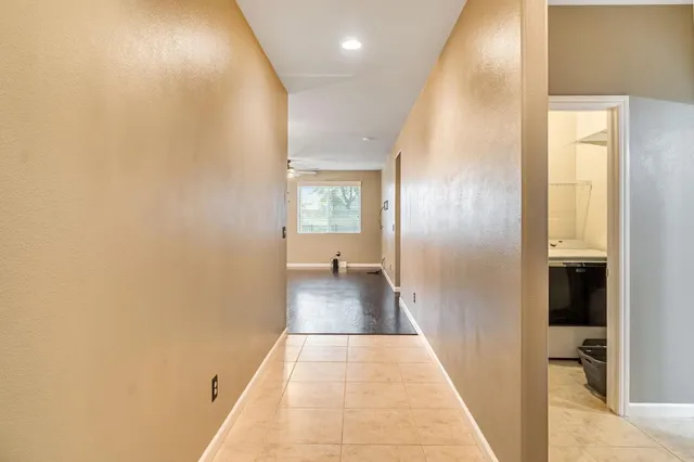 a view of kitchen with window and wooden floor
