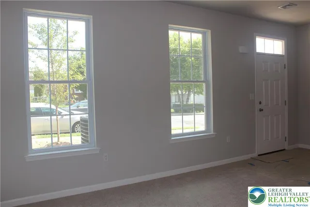 an empty room with windows