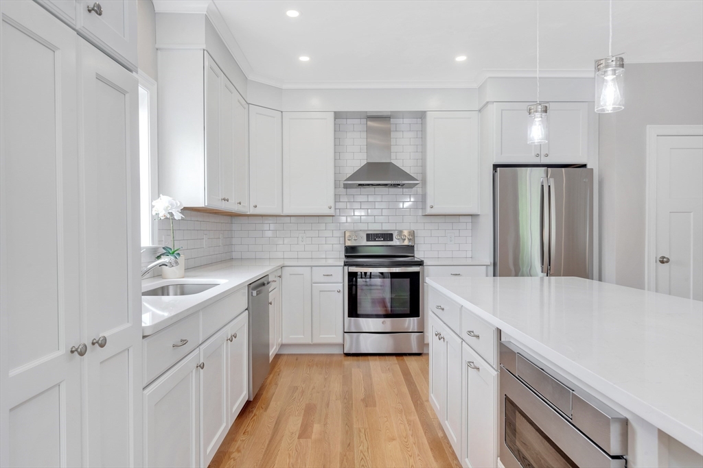 8 Weber Farm Road, Unit 8 Wrentham, MA 02093 - Photo 23 of 35 a kitchen with stainless steel appliances a sink stove and refrigerator