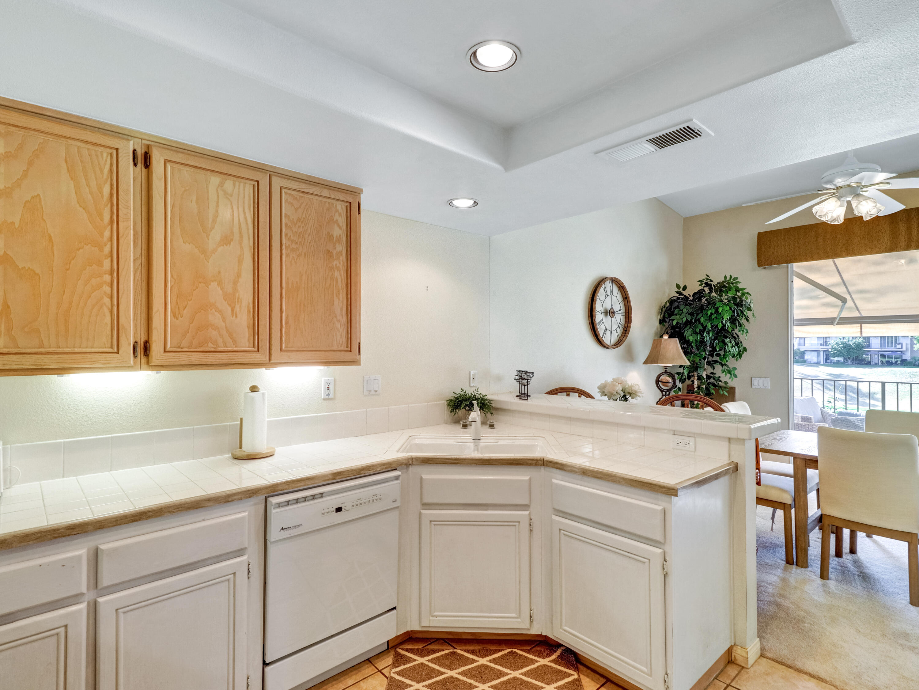 55393 Winged Foot La Quinta, CA 92253 - Photo 12 of 29 a kitchen with a sink and cabinets