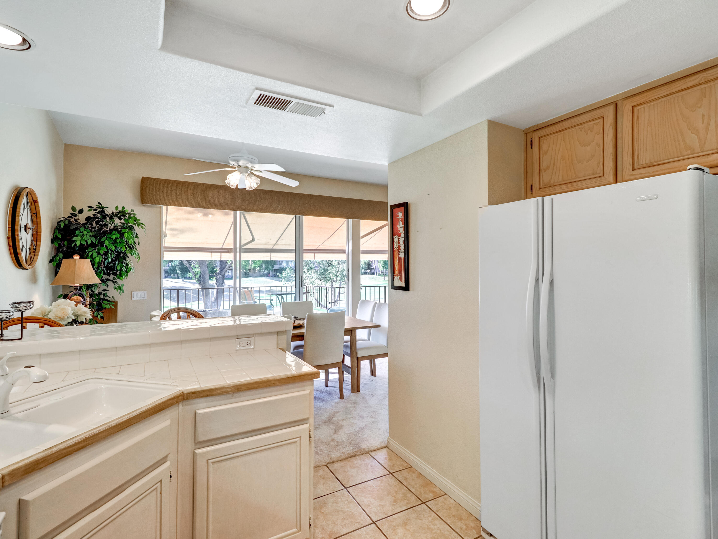 55393 Winged Foot La Quinta, CA 92253 - Photo 13 of 29 a kitchen with a refrigerator and a sink