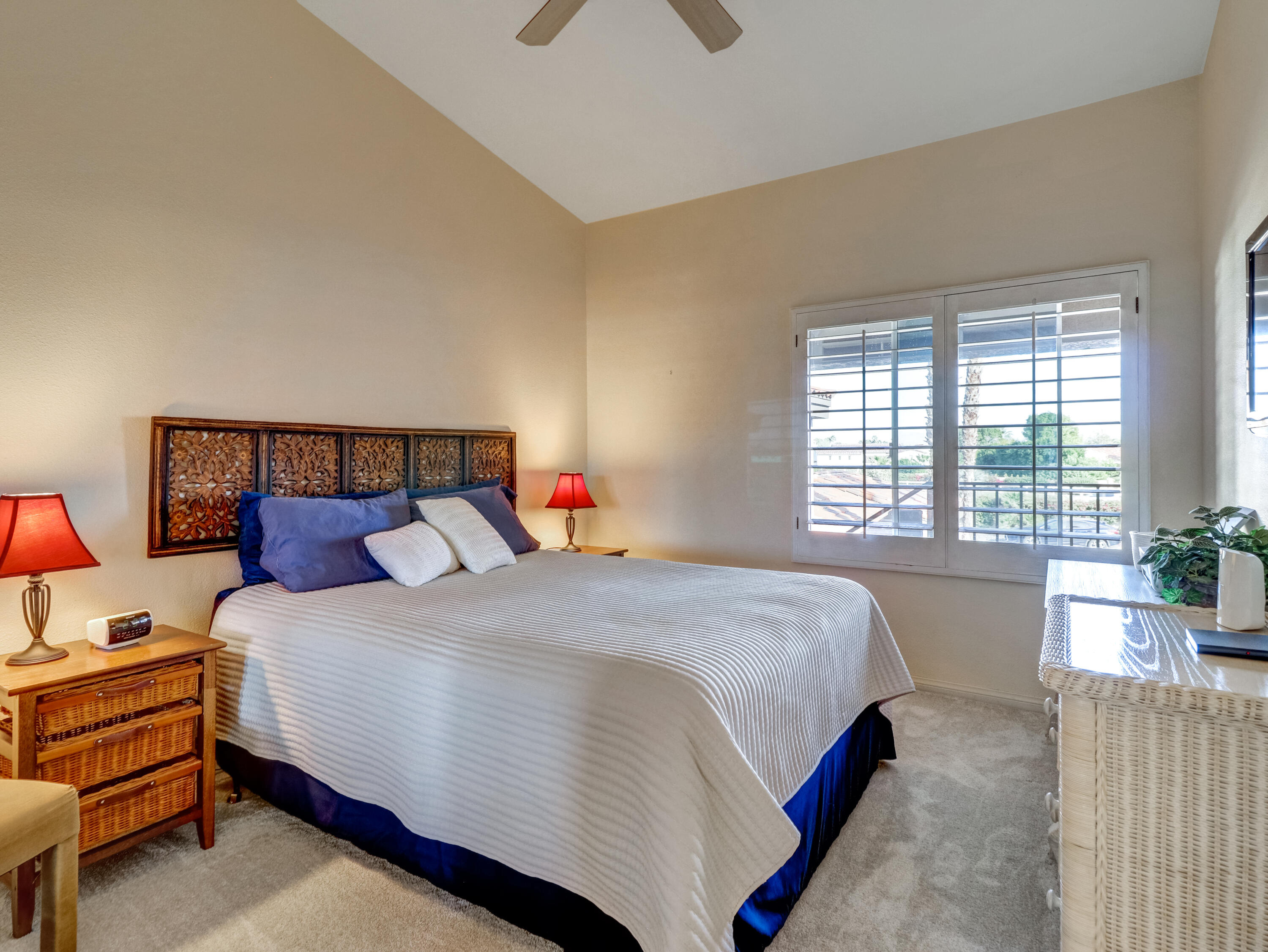 55393 Winged Foot La Quinta, CA 92253 - Photo 17 of 29 a bedroom with a bed and a window