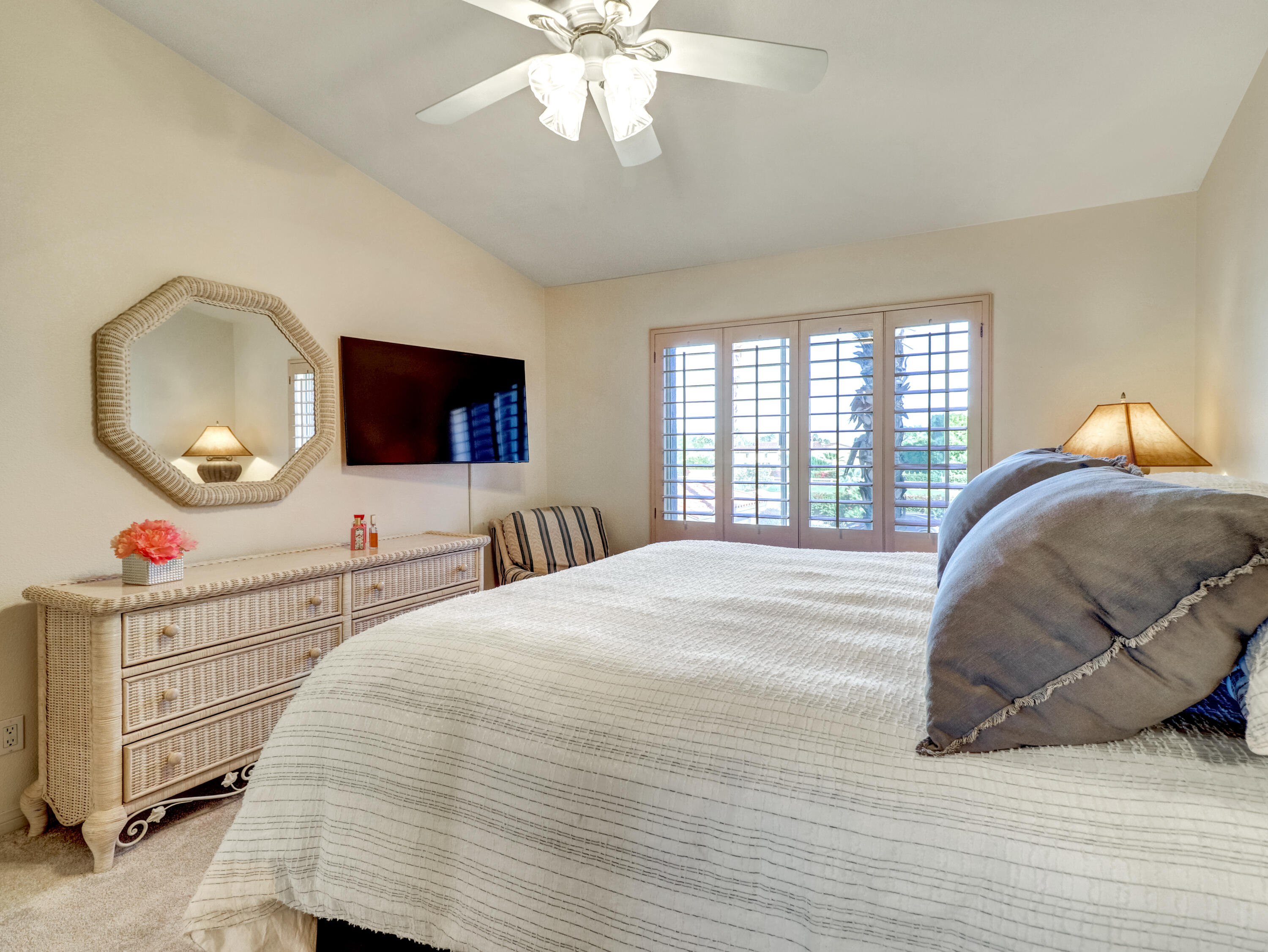 55393 Winged Foot La Quinta, CA 92253 - Photo 20 of 29 a bedroom with a large bed and a flat screen tv